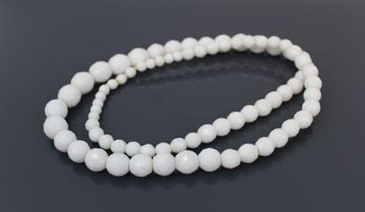 Long necklace adorned with white freshwater...