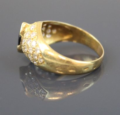 Yellow gold 750°/°° ring centered on a half-set...