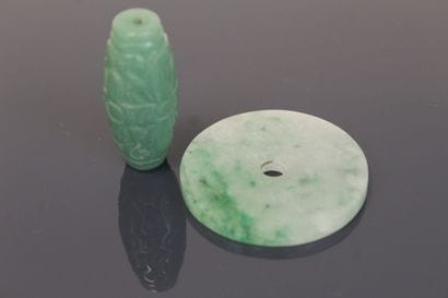 Oblong jade bead engraved with a stylized...