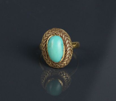 A yellow gold 750°/°° ring set with a turquoise...
