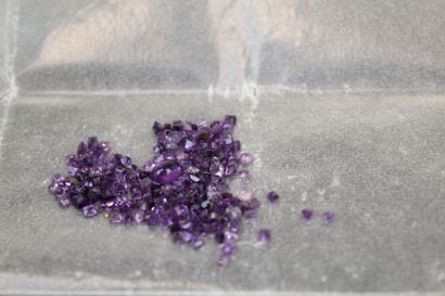 7 lilac-colored emerald-cut amethysts 
one...