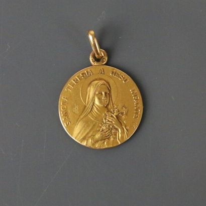 Religious medal in yellow gold 750°/°° representing...
