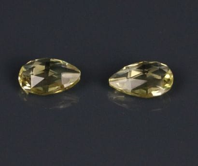Two pierced briolette-cut lemon citrines
Size:...