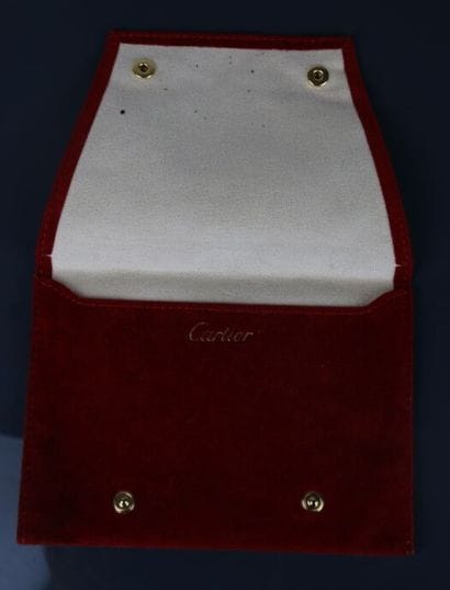 CARTIER
Ecrin de montre et une pochette en...