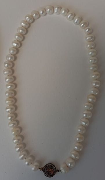 Fallen cultured pearl necklace with metal...