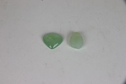 Two chrysoprases, one cabochon-cut stylizing...