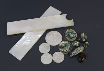 Four circular mother-of-pearl plates engraved...