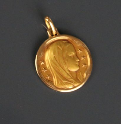 Religious medal depicting the Virgin Mary...