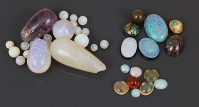 Four brown or boulder opals, two composite...