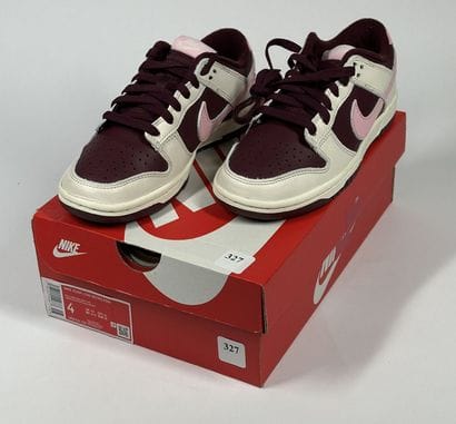 NIKE 
A pair of low-top sneakers,
Model:...