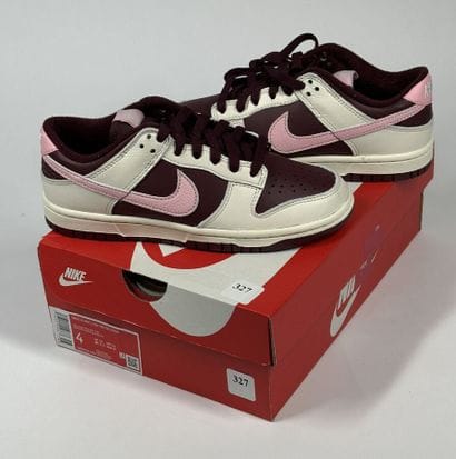 NIKE 
A pair of low-top sneakers,
Model:...