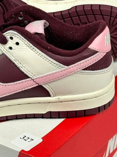 NIKE 
A pair of low-top sneakers,
Model:...