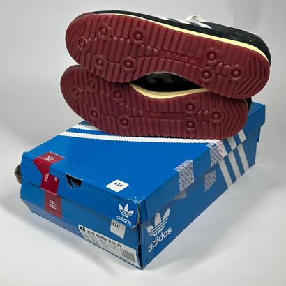 ADIDAS
A pair of low-top sneakers,
Model...