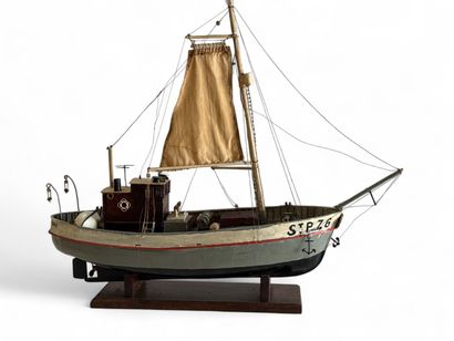 Single-sailed wooden fishing boat, hull painted...