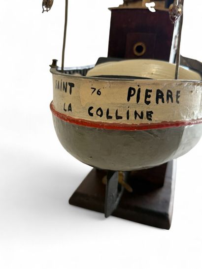 Single-sailed wooden fishing boat, hull painted...