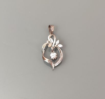 Leaf-shaped silver pendant holding a brilliant-cut...