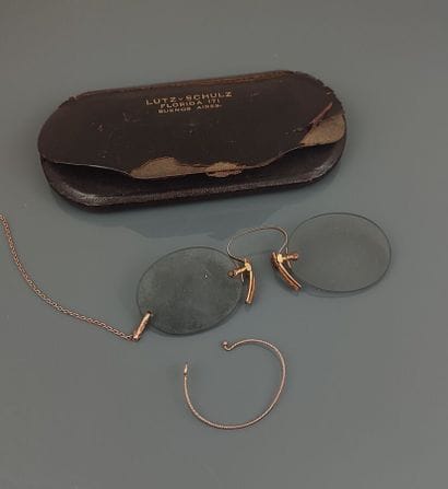 A pair of pince-nez sunglasses with oval...