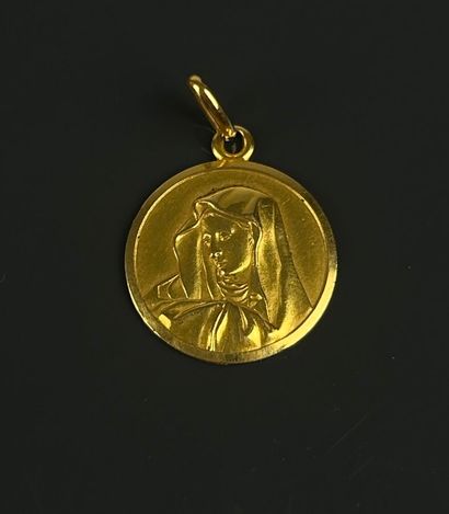 Engraved religious medal of the Virgin Mary...