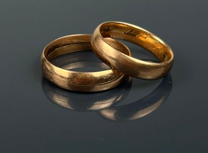 Three wedding bands in yellow and pink gold...