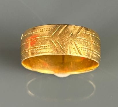 Three wedding bands in yellow and pink gold...