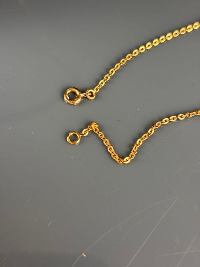 Cross in yellow gold 750°/°° set with a half...