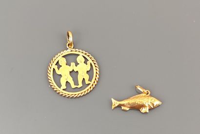 Two pendants in yellow gold 750°/°° one representing...