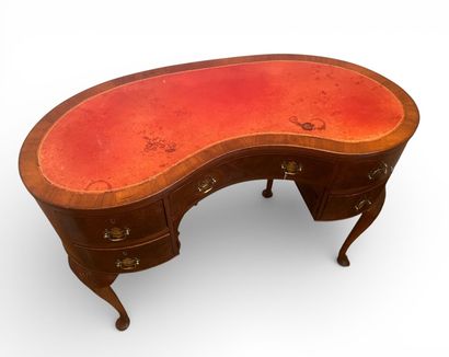 Veneered kidney-shaped desk opening with...