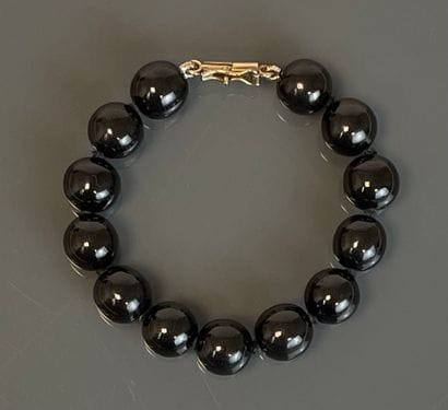 Ensemble comprenant un collier, un bracelet...