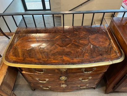 Veneered chest of drawers opening with three...
