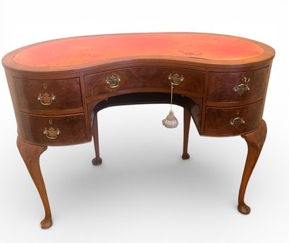 Veneered kidney-shaped desk opening with...