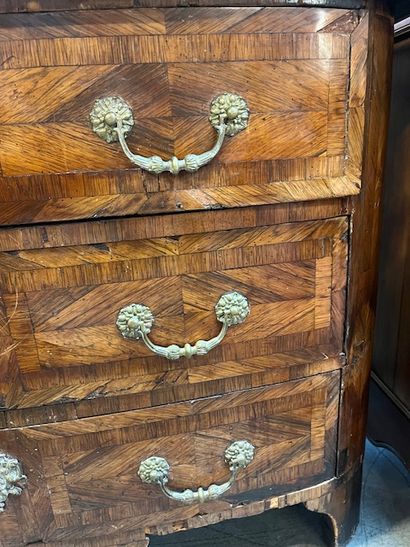 Veneered chest of drawers opening with three...