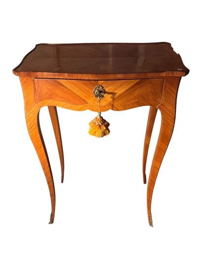 Small inlaid wood table opening with a drawer...