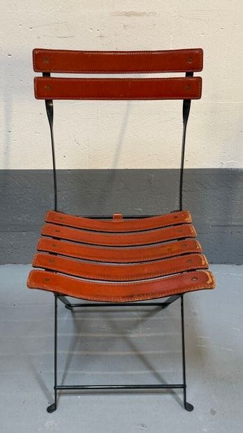 Folding chair with metal frame and brown...
