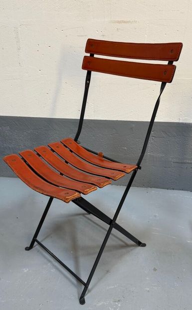 Folding chair with metal frame and brown...