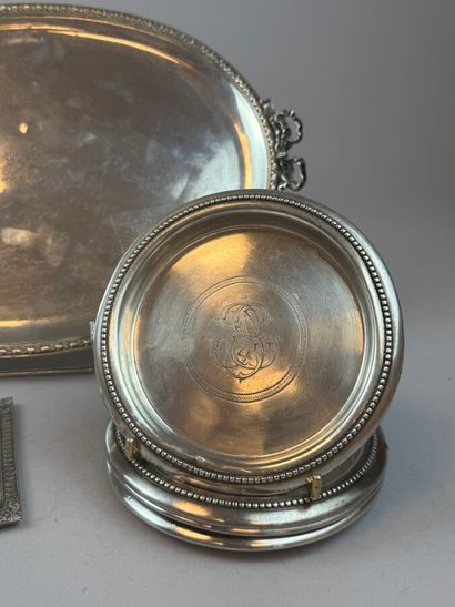 Four 925°/°° silver bottle coasters, with...