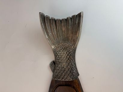 Fish-shaped cutting board made of wood and...