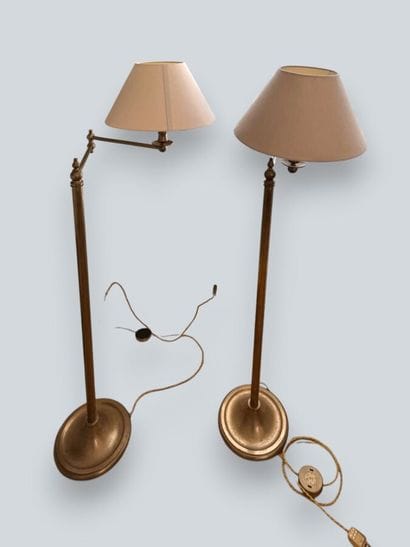 Two brass reading lamps with folding arms....
