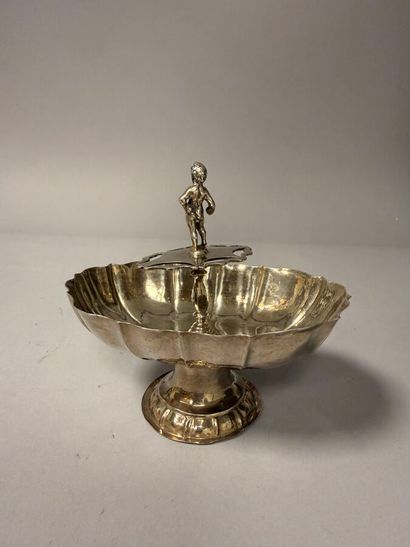 Oblong silver display piece with a scalloped...