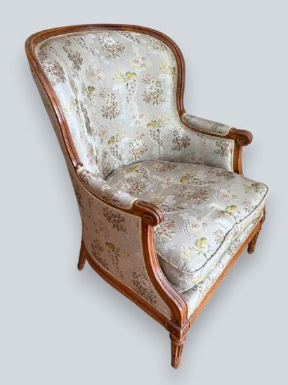Armchair with a gondola-style backrest made...