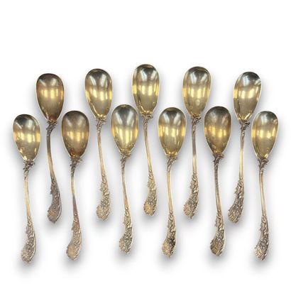 A set of eleven silver teaspoons decorated...