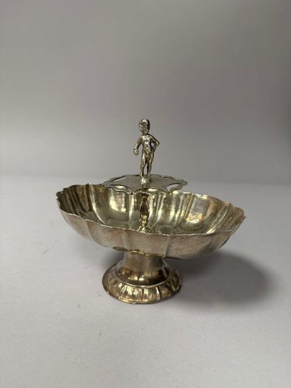 Oblong silver display piece with a scalloped...