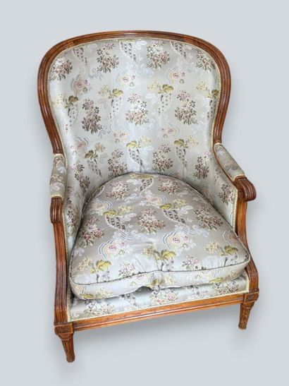 Armchair with a gondola-style backrest made...