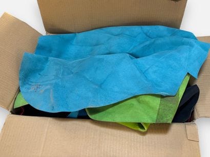 [LEATHER HANDLE]
Box containing various hides,...