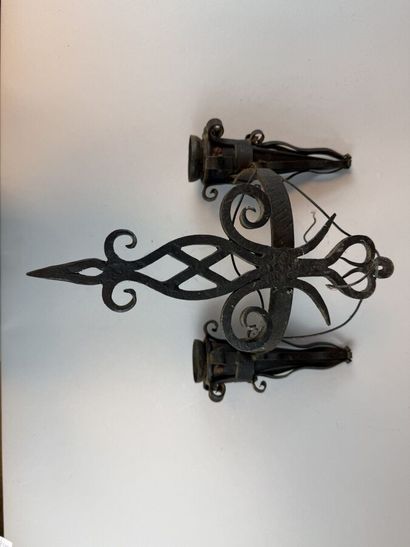 Set of six black-patinated wrought-iron wall...