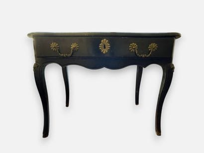 Blackened wooden desk with a drawer that...