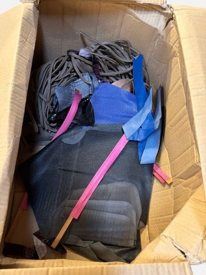 [LEATHER HANDLE]
Box containing leather scraps,...