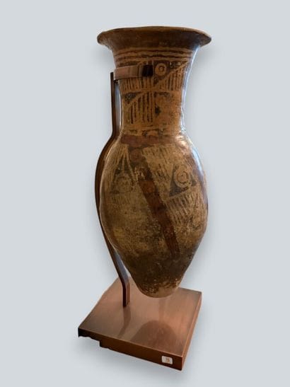 Two terracotta urns with geometric decoration,...