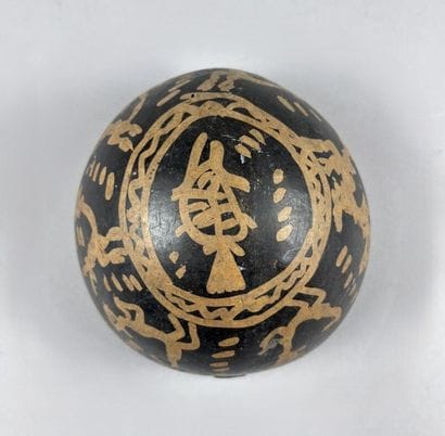 Handcrafted calabash decorated with brown...