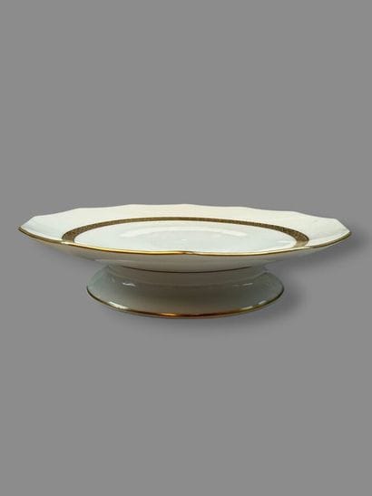 LIMOGES
Porcelain dinner service with a gold...