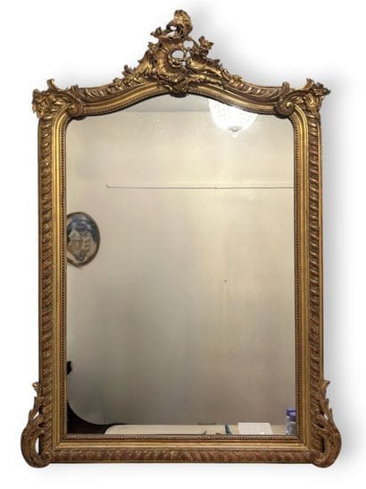 Wooden mirror with gilded stucco, decorated...